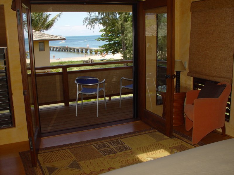 The master bedroom deck with french doors looking west